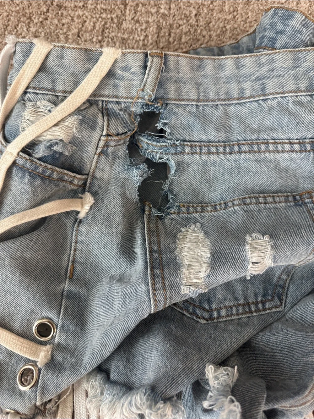 Distressed Light Blue Denim Shoe Lace Grommet Fringe Shorts